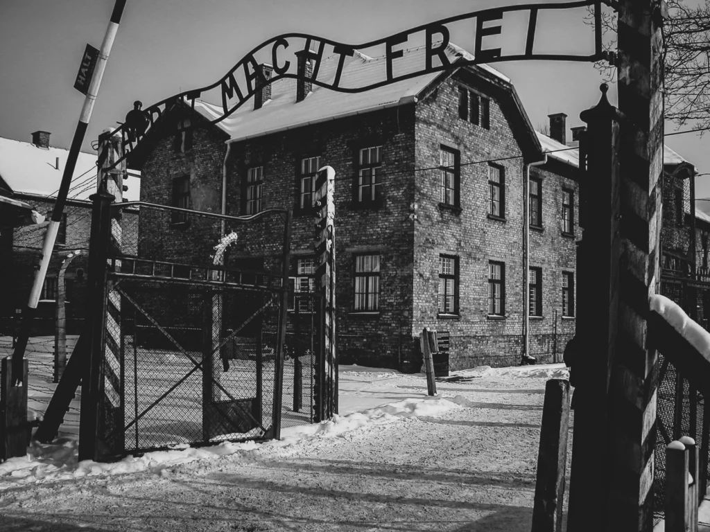 The historic entrance gate and brick buildings at Auschwitz I