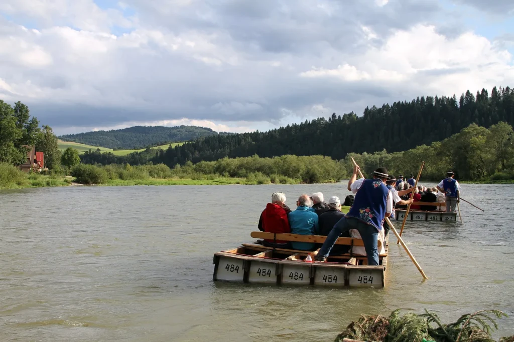Passengers aboard a traditional wooden raft on the Dunajec River